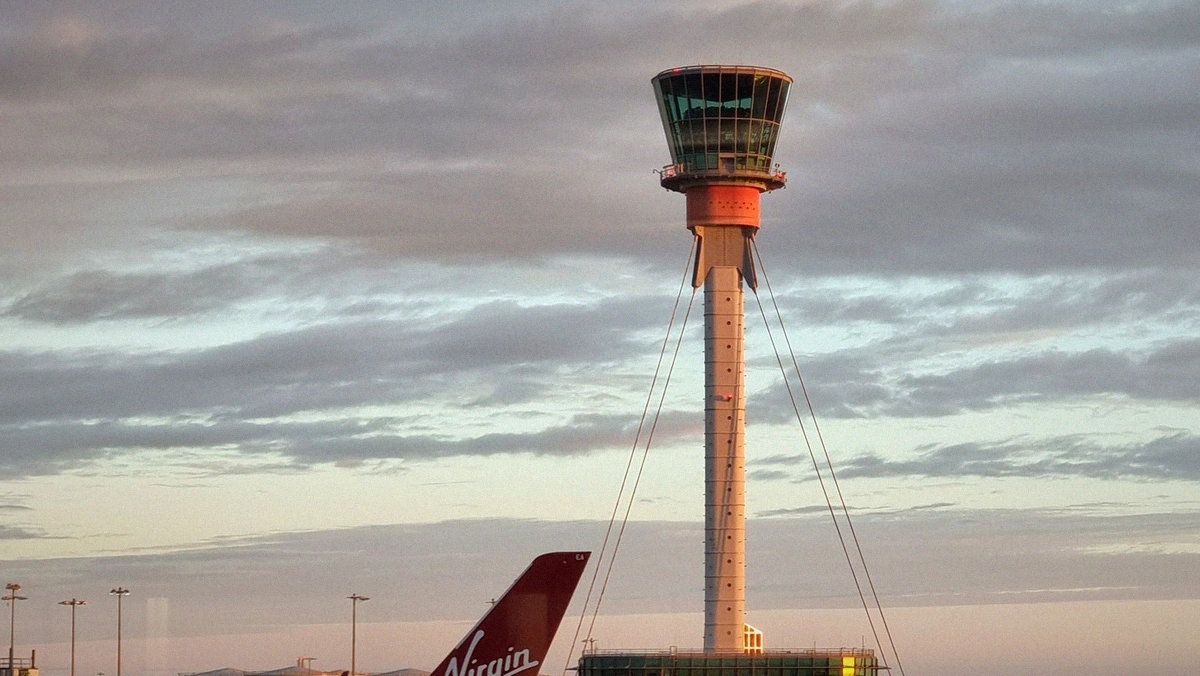 air traffic controller pay raise control tower exterior at an airport during dusk light