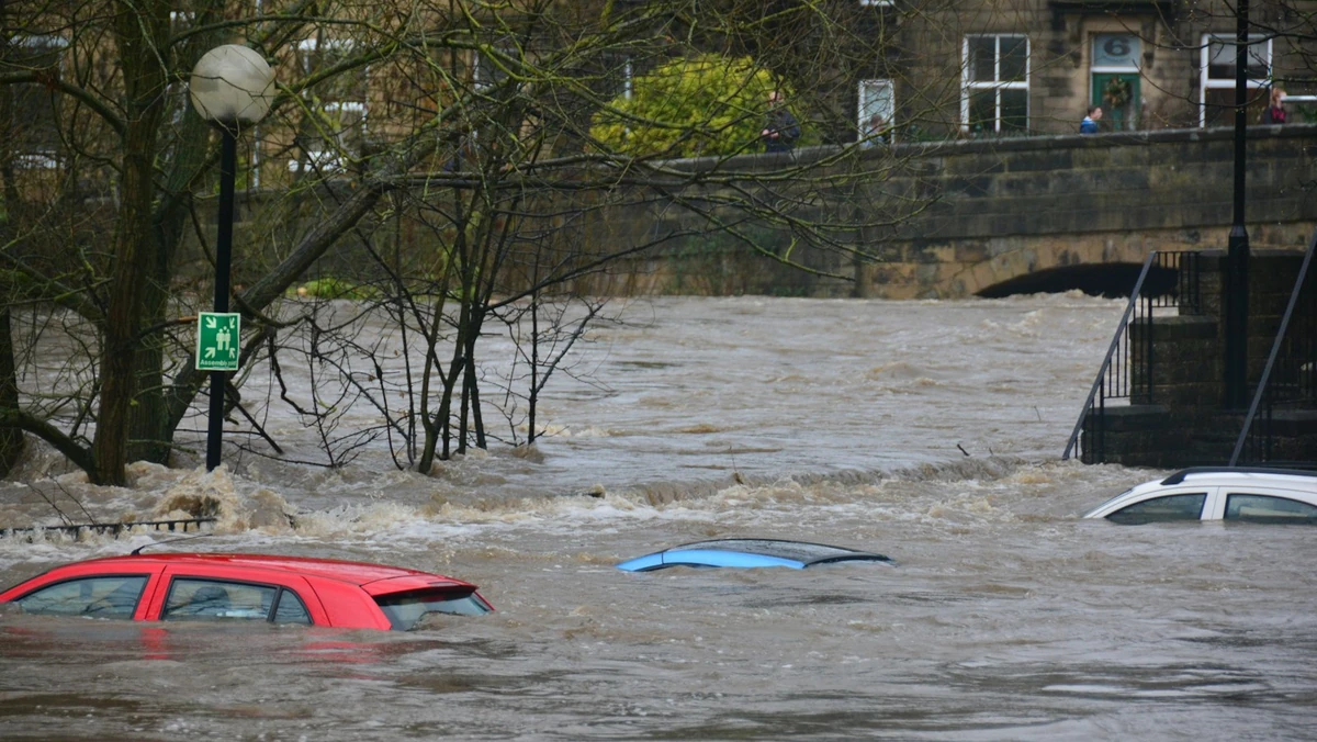 Floodwaters surrounding vehicles illustrating Ohio State Highway Patrol flood traffic response on US-23