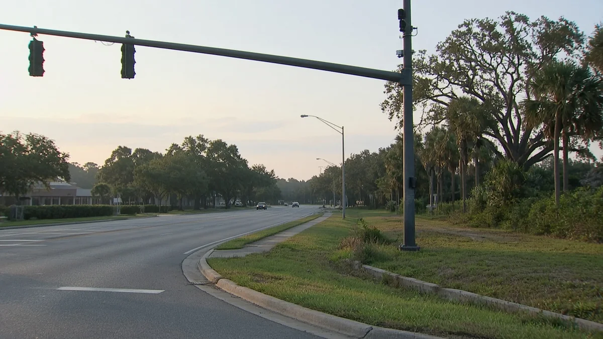 St. Lucie County ALPR cameras removal notices on roadside pole