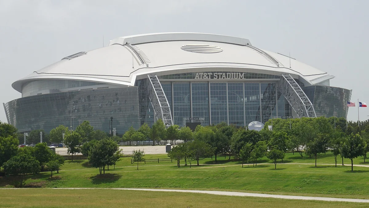 AT&T Stadium in Arlington seen across a green park on a summer day, the Cowboys’ home field for Thursday’s game after the Cowboys comeback win in Houston