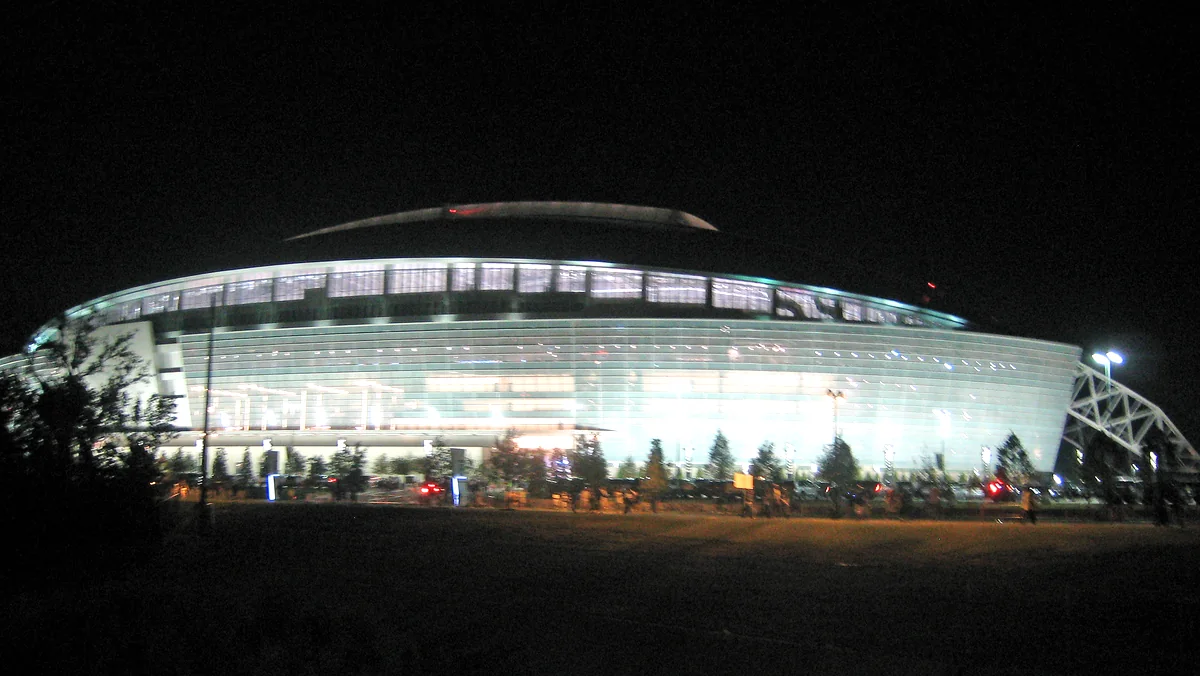 AT&T Stadium in Arlington glowing at night in 2009, when it was still called Cowboys Stadium, the venue for Cowboys vs. Buccaneers on Thursday night