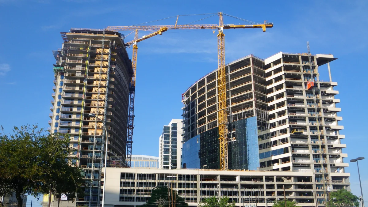 Tower cranes over two high-rises under construction in Uptown Dallas in 2009, the kind of height at issue in the Preston Royal zoning case