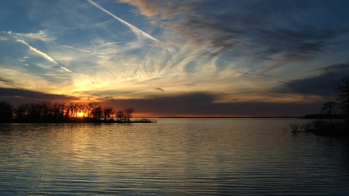 Sunset over Lake Ray Roberts in North Texas, near the land proposed for the Triple T Ranch development